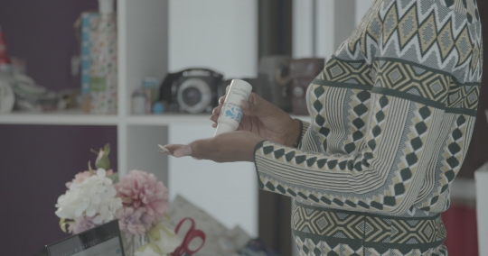 Lady sanitizing her hands