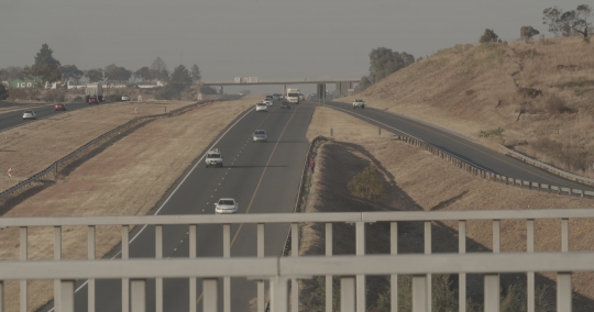 Traffic under a fly over bridge